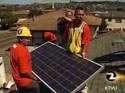 Green collar workers installing solar paneling