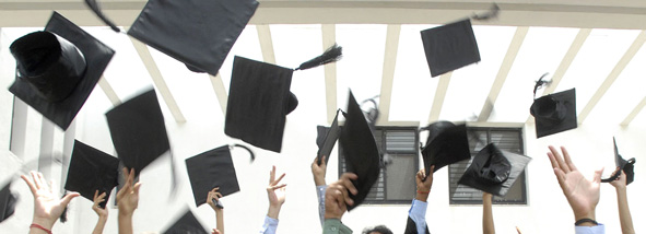 Grads tossing their hats in the air