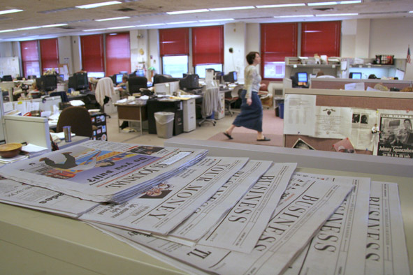 Newspapers in a newsroom