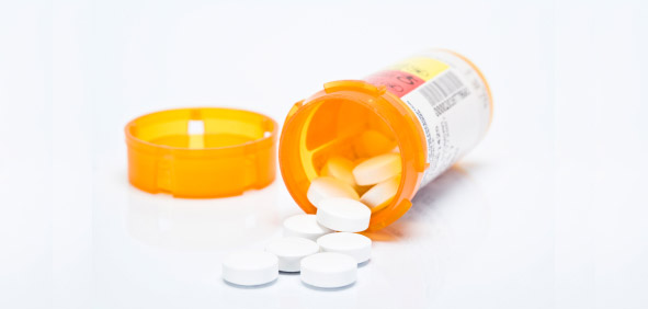 pills spilling out of a bottle