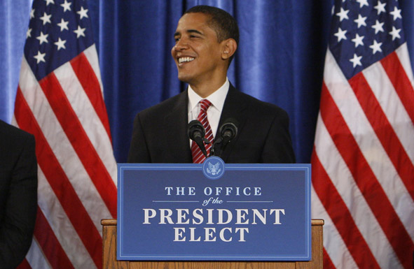 Barack Obama at lecturn with Office of the President-elect sign