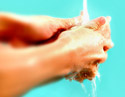 two hands washing on a blue background