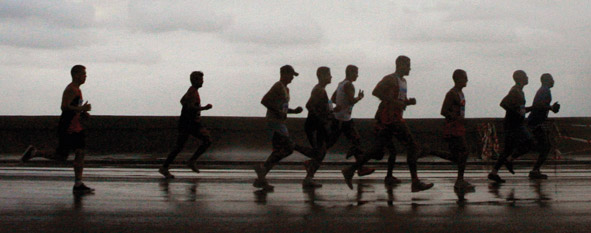 men running in road race