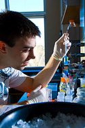 young man working in biochem lab