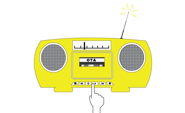 hand pressing Play button on tape deck wtih OTA cassette