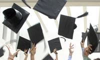 grads throwing hats in the air