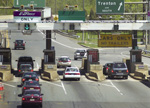 cars approaching a toll booth