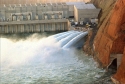 water getting released at the base of a dam