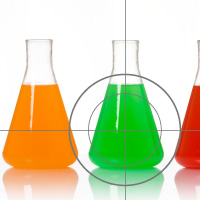row of beakers with one centered in a crosshair