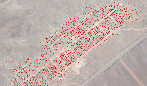 The Porta Farm settlement in Zimbabwe, where government forces demolished the homes of about 700,000 people in 2005. This image analysis by AAAS shows 870 destroyed structures.  © Copyright 2006 DigitalGlobe Inc.