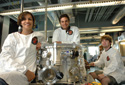 engineering students wearing white coats in lab