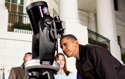 President Obama peers into a telescope during the Astronomy Night event on the South Lawn of the White House