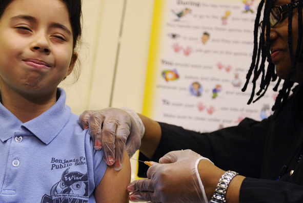 girl receiving H1N1 vaccine