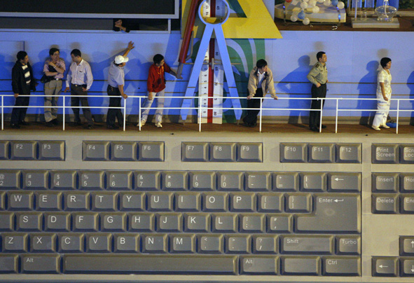 Chinese participants stand onboard a giant float with a theme of science and technology moving towards Tiananmen Square for a major rehearsal ahead of the 60th National Day celebrations in Beijing, China, Friday, Sept. 18, 2009.
