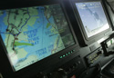The Statue of Liberty appears on one screen and a map of New York on another in the New York Police Department's surveillance helicopter in New York.