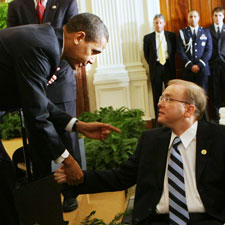 President Barack Obama shakes hands with Rep. Jim Langevin, (D-RI), after signing an Executive Order on stem cells and a Presidential Memorandum on scientific integrity, Monday, March 9, 2009, in the East Room of the White House in Washington.