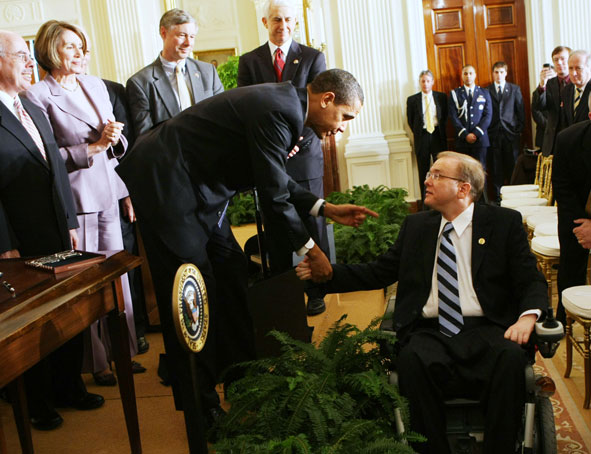 President Barack Obama shakes hands with Rep. Jim Langevin, (D-RI), after signing an Executive Order on stem cells and a Presidential Memorandum on scientific integrity, Monday, March 9, 2009, in the East Room of the White House in Washington.